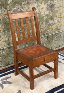 Original Roycroft chair with tacked leather insert and carved Roycroft Orb signature.
